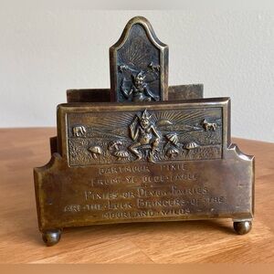 Vintage bronze letter holder with pixie imagery